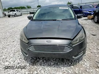 2017 Ford Focus Titanium z VIN 1FADP3N22HL307260, wystawiony jako Copart lot #61399785 z przebiegiem 103 293 mil mil oraz Szkoda całkowita • Salvage title. Historia ofert i sprzedaży dostępna na DreamBid. Obrazek 13.