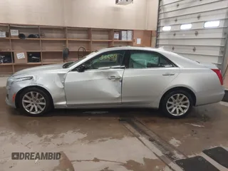 2014 Cadillac CTS Luxury AWD with VIN 1G6AX5S3XE0158960, listed as a IAAI auction lot 41258609 with 84,360 mi miles and . Bid and sale history available at DreamBid. Image 14.