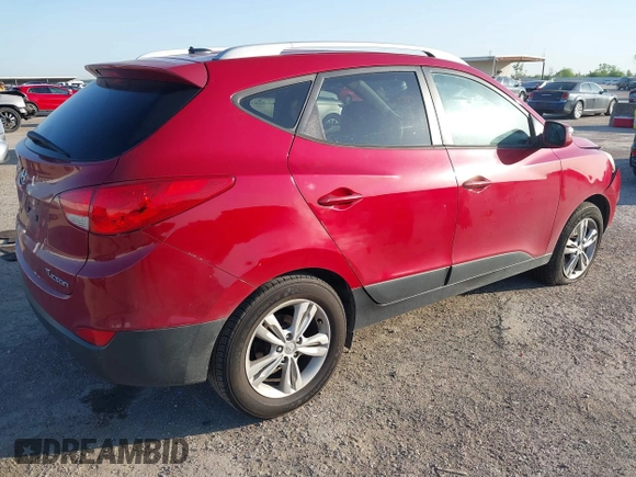 2013 Hyundai Tucson GLS with VIN KM8JU3AC6DU763590, listed as a IAAI auction lot 41999555 with 149,960 mi miles. Bid and sale history available at carsss.com. Image 4.