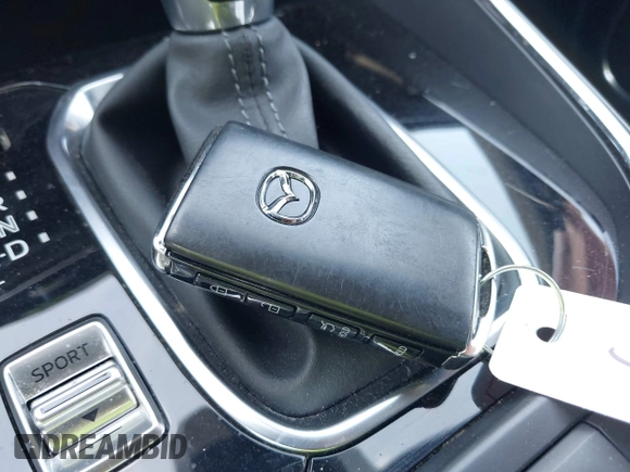 2020 Mazda CX-9 Grand Touring z VIN JM3TCADY8L0417775, wystawiony jako IAAI lot #42306864 z przebiegiem 35 287 mil mil oraz . Historia ofert i sprzedaży dostępna na DreamBid. Obrazek 11.