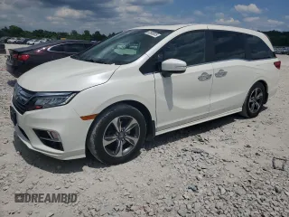 2018 Honda Odyssey Touring z VIN 5FNRL6H8XJB023719, wystawiony jako Copart lot #62695035 z przebiegiem 150 847 mil mil oraz Szkoda całkowita • Salvage title. Historia ofert i sprzedaży dostępna na DreamBid. Obrazek 1.