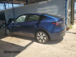 2023 Tesla Model Y Long Range with VIN 7SAYGDEE7PA112865, listed as a Copart auction lot 54626685 with 10,720 mi miles and Salvage Title. Bid and sale history available at DreamBid. Image 2.