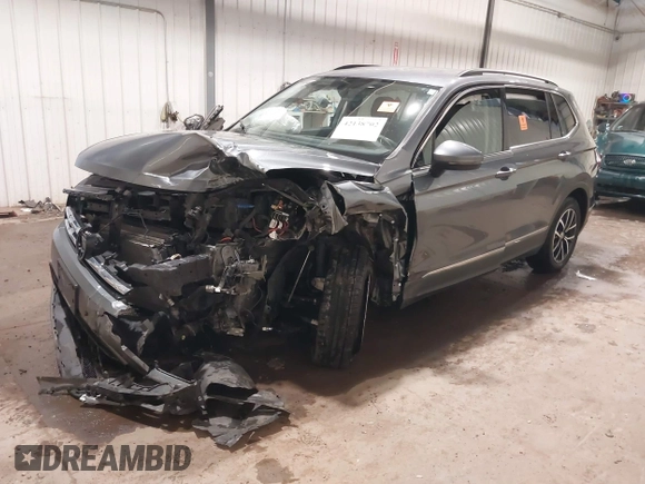2021 Volkswagen Tiguan SE with VIN 3VV3B7AX3MM118463, listed as a IAAI auction lot 42138702 with 48,058 mi miles and . Bid and sale history available at DreamBid. Image 2.