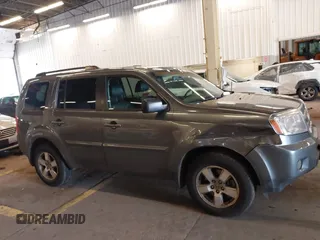 2011 Honda Pilot EX-L with VIN 5FNYF4H65BB020721, listed as a IAAI auction lot 41794436 with 113,630 mi miles and . Bid and sale history available at carsss.com. Image 13.