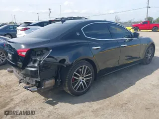 2015 Maserati Ghibli with VIN ZAM57XSA9F1146055, listed as a IAAI auction lot 41814633 with 88,783 mi miles. Bid and sale history available at carsss.com. Image 4.