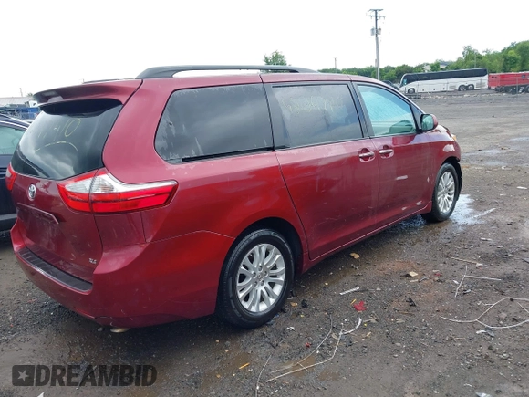 2015 Toyota Sienna XLE with VIN 5TDYK3DC9FS569714, listed as a IAAI auction lot 42297410 with 114,802 mi miles and . Bid and sale history available at DreamBid. Image 4.