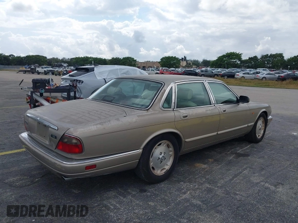 1997 Jaguar XJ with VIN SAJHX1243VC811786, listed as a IAAI auction lot 41451521 with Not provided miles and . Bid and sale history available at DreamBid. Image 4.