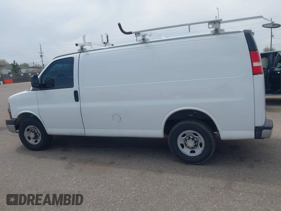 2012 Chevrolet Express Cargo Van with VIN 1GCWGFCA7C1121989, listed as a IAAI auction lot 42118853 with 214,478 mi miles. Bid and sale history available at carsss.com. Image 14.