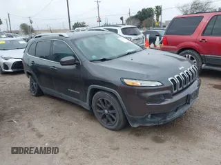 2016 Jeep Cherokee 75th Anniversary with VIN 1C4PJLCB9GW166857, listed as a IAAI auction lot 41435610 with 130,856 mi miles. Bid and sale history available at carsss.com. Image 1.