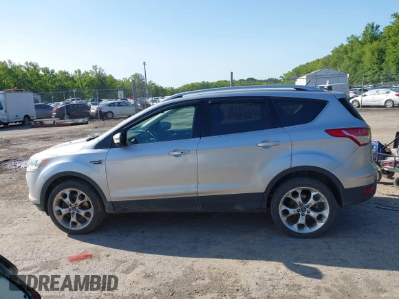 2016 Ford Escape Titanium with VIN 1FMCU9J97GUB91966, listed as a IAAI auction lot 42378829 with 121,218 mi miles and . Bid and sale history available at DreamBid. Image 14.