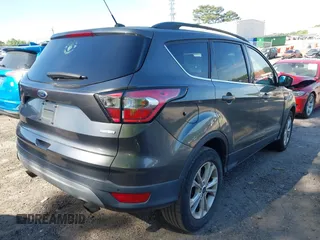 2017 Ford Escape SE z VIN 1FMCU0GDXHUB66813, wystawiony jako IAAI lot #42056150 z przebiegiem 86 915 mil mil oraz . Historia ofert i sprzedaży dostępna na DreamBid. Obrazek 4.