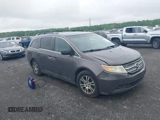 2012 Honda Odyssey EX-L with VIN 5FNRL5H64CB060468, listed as a IAAI auction lot 42182501 with 236,399 mi miles and . Bid and sale history available at carsss.com. Image 1.