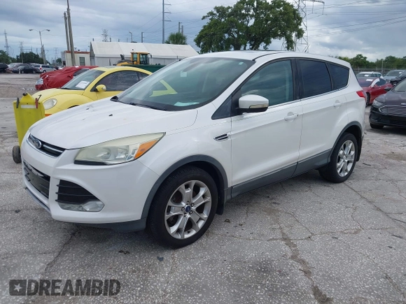 2013 Ford Escape SEL z VIN 1FMCU9HX5DUC33079, wystawiony jako IAAI lot #42521744 z przebiegiem 133 864 mil mil oraz . Historia ofert i sprzedaży dostępna na DreamBid. Obrazek 2.
