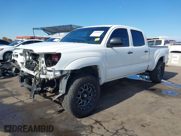 2014 Toyota Tacoma with VIN 3TMMU4FN9EM062808, listed as a IAAI auction lot 41450058 with 192,628 mi miles and . Bid and sale history available at DreamBid. Image 18.