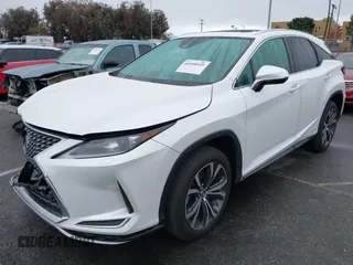 2020 Lexus RX with VIN 2T2HGMDA1LC052493, listed as a IAAI auction lot 41450535 with 63,547 mi miles. Bid and sale history available at carsss.com. Image 2.