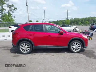 2014 Mazda CX-5 Grand Touring with VIN JM3KE2DY3E0382920, listed as a IAAI auction lot 42102876 with 324,608 mi miles. Bid and sale history available at carsss.com. Image 13.