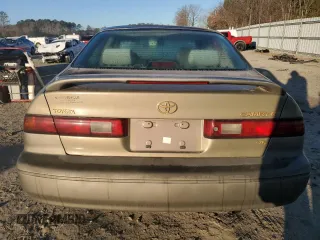 1999 Toyota Camry LE z VIN JT2BF22K0X0167589, wystawiony jako Copart lot #42699015 z przebiegiem 198 634 mil mil oraz Czysty tytuł • Clean title. Historia ofert i sprzedaży dostępna na DreamBid. Obrazek 6.