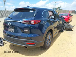 2022 Mazda CX-9 Touring z VIN JM3TCBCY7N0600370, wystawiony jako IAAI lot #42658049 z przebiegiem 113 000 mil mil oraz . Historia ofert i sprzedaży dostępna na DreamBid. Obrazek 4.