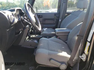 2007 Jeep Wrangler Unlimited Sahara with VIN 1J4GA59197L141821, listed as a Copart auction lot 76897044 with 124,070 mi miles and Salvage title. Bid and sale history available at DreamBid. Image 7.