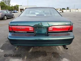 1994 Ford Thunderbird LX with VIN 1FALP62W6RH128762, listed as a Copart auction lot 84306604 with 68,314 mi miles and Salvage Title. Bid and sale history available at DreamBid. Image 6.
