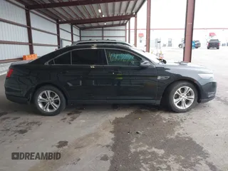 2015 Ford Taurus SEL z VIN 1FAHP2E86FG165100, wystawiony jako IAAI lot #42157272 z przebiegiem 141 846 mil mil oraz . Historia ofert i sprzedaży dostępna na DreamBid. Obrazek 13.