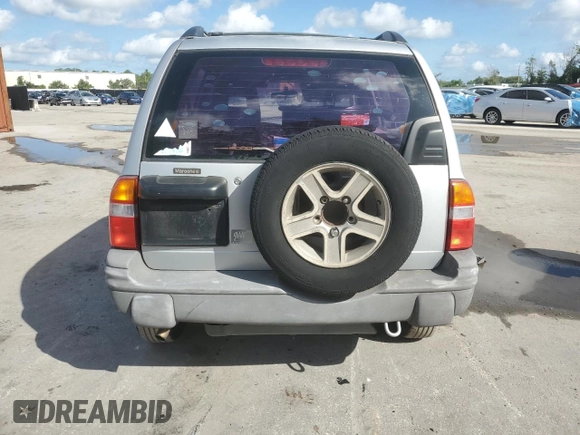 2003 Chevrolet Tracker with VIN 2CNBE13C836953178, listed as a Copart auction lot 60715605 with 128,978 mi miles and Salvage title. Bid and sale history available at DreamBid. Image 6.