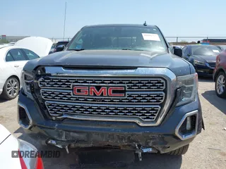 2019 GMC Sierra 1500 Denali z VIN 1GTU9FEL5KZ387012, wystawiony jako IAAI lot #42002743 z przebiegiem 124 718 mil mil oraz . Historia ofert i sprzedaży dostępna na DreamBid. Obrazek 12.