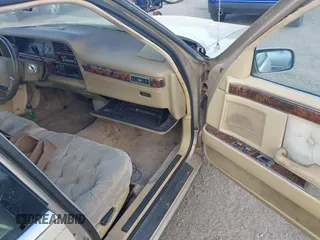 1991 Chrysler New Yorker z VIN 1C3XY66R1MD290736, wystawiony jako IAAI lot #41932377 z przebiegiem 176 868 mil mil oraz . Historia ofert i sprzedaży dostępna na DreamBid. Obrazek 5.
