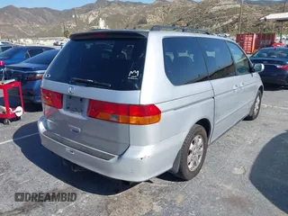 2002 Honda Odyssey EX-L z VIN 2HKRL18922H582244, wystawiony jako IAAI lot #42385121 z przebiegiem 253 186 mil mil oraz . Historia ofert i sprzedaży dostępna na DreamBid. Obrazek 4.