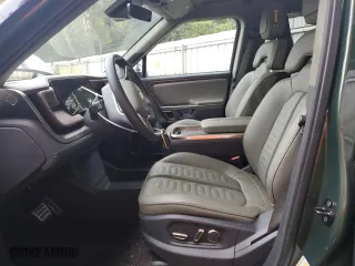 2023 Rivian R1S Adventure with VIN 7PDSGABA4PN014067, listed as a Copart auction lot 77630794 with 0 mi miles and Salvage Title. Bid and sale history available at carsss.com. Image 7.