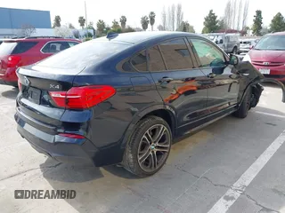 2015 BMW X4 xDrive35i with VIN 5UXXW5C50F0E87728, listed as a IAAI auction lot 41819628 with 136,042 mi miles and . Bid and sale history available at DreamBid. Image 4.