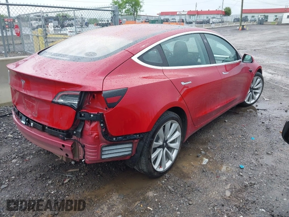 2018 Tesla Model 3 Long Range Battery with VIN 5YJ3E1EA6JF052659, listed as a IAAI auction lot 42093903 with 49,255 mi miles and . Bid and sale history available at DreamBid. Image 4.