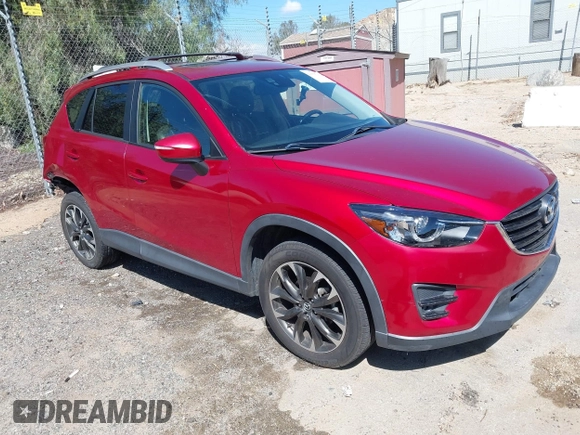 2016 Mazda CX-5 Grand Touring with VIN JM3KE2DY3G0686588, listed as a IAAI auction lot 41697312 with 65,090 mi miles. Bid and sale history available at carsss.com. Image 1.