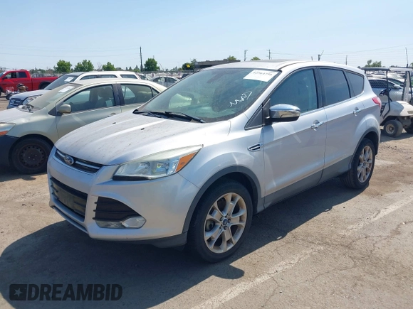 2013 Ford Escape SEL z VIN 1FMCU9H95DUC87631, wystawiony jako IAAI lot #42564756 z przebiegiem 144 467 mil mil oraz . Historia ofert i sprzedaży dostępna na DreamBid. Obrazek 2.