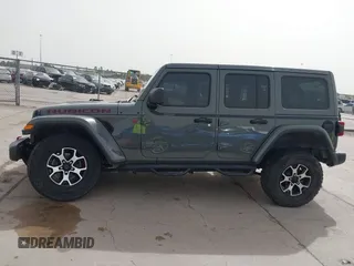 2020 Jeep Wrangler Unlimited Rubicon z VIN 1C4HJXFG2LW267154, wystawiony jako IAAI lot #41745497 z przebiegiem 28 692 mil mil oraz . Historia ofert i sprzedaży dostępna na DreamBid. Obrazek 15.