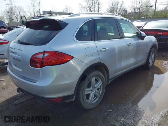 2011 Porsche Cayenne S Hybrid with VIN WP1AE2A20BLA91823, listed as a IAAI auction lot 41919847 with 190,623 mi miles. Bid and sale history available at carsss.com. Image 4.