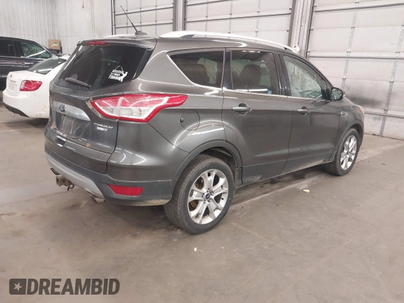 2015 Ford Escape Titanium with VIN 1FMCU9J96FUA43337, listed as a IAAI auction lot 41825328 with 149,639 mi miles and . Bid and sale history available at DreamBid. Image 4.