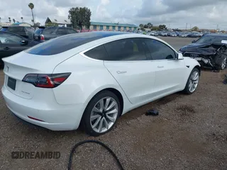 2019 Tesla Model 3 Long Range with VIN 5YJ3E1EBXKF512710, listed as a IAAI auction lot 42063737 with 90,721 mi miles and . Bid and sale history available at DreamBid. Image 4.