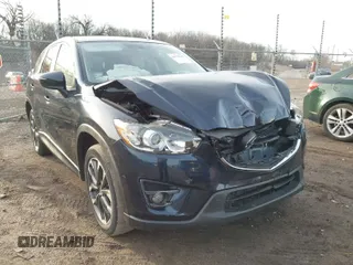 2016 Mazda CX-5 Grand Touring with VIN JM3KE4DY1G0823989, listed as a IAAI auction lot 41770149 with 40,677 mi miles. Bid and sale history available at carsss.com. Image 1.
