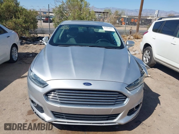 2014 Ford Fusion Titanium Hybrid with VIN 3FA6P0RUXER103516, listed as a IAAI auction lot 42004602 with 128,287 mi miles and . Bid and sale history available at carsss.com. Image 12.