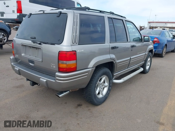 1998 Jeep Grand Cherokee Limited with VIN 1J4GZ88Z6WC307986, listed as a IAAI auction lot 41539972 with 150,652 mi miles. Bid and sale history available at carsss.com. Image 4.