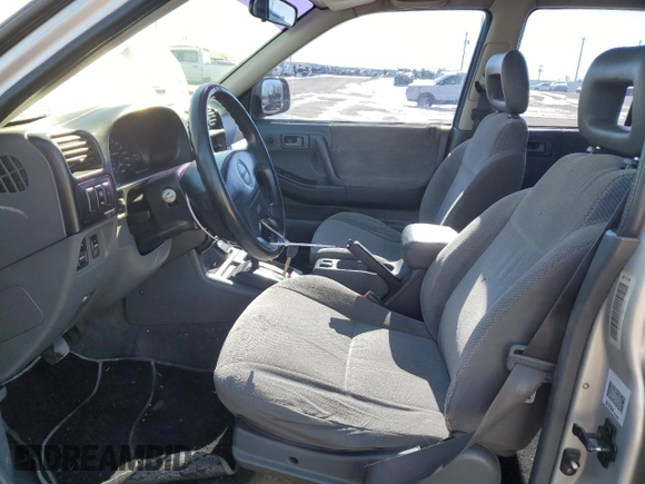 1999 Isuzu Rodeo S with VIN 4S2CK58WXX4373485, listed as a Copart auction lot 87804995 with 246,518 mi miles and Salvage title. Bid and sale history available at DreamBid. Image 7.