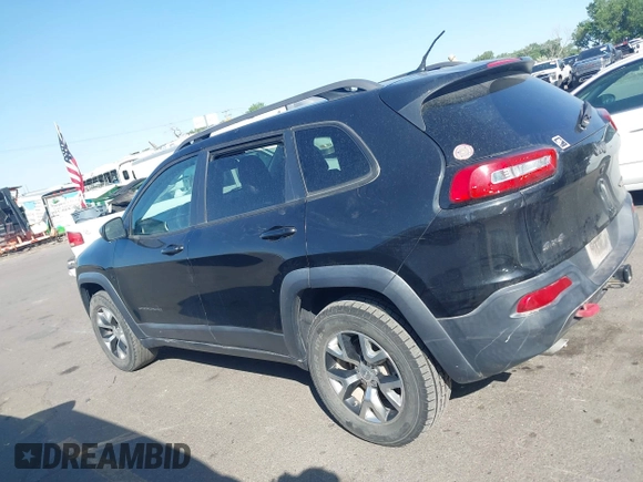 2015 Jeep Cherokee Trailhawk with VIN 1C4PJMBS4FW556822, listed as a IAAI auction lot 42412874 with 129,865 mi miles and . Bid and sale history available at DreamBid. Image 14.