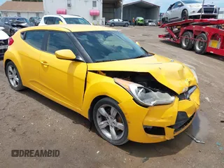 2012 Hyundai Veloster w/Black Int with VIN KMHTC6AD5CU046702, listed as a IAAI auction lot 42245379 with 136,327 mi miles and . Bid and sale history available at DreamBid. Image 1.