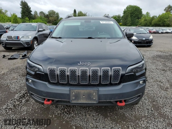 2019 Jeep Cherokee Trailhawk with VIN 1C4PJMBX4KD121641, listed as a Copart auction lot 57128905 with 129,206 mi miles and Salvage title. Bid and sale history available at DreamBid. Image 5.