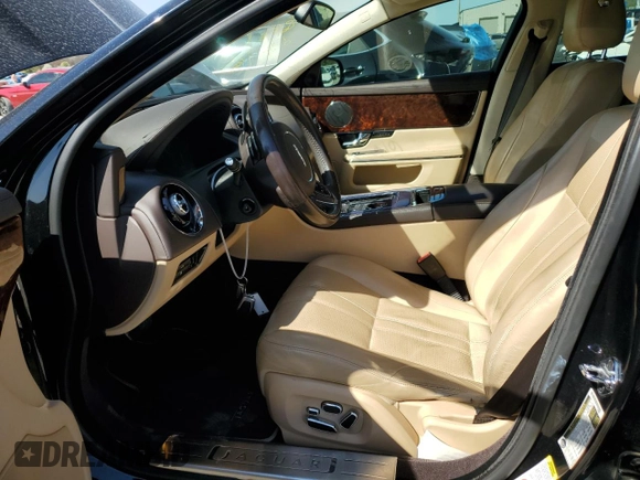 2012 Jaguar XJ with VIN SAJWA1CB5CLV29023, listed as a Copart auction lot 48300165 with 42,725 mi miles and Salvage title. Bid and sale history available at DreamBid. Image 7.