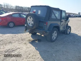2014 Jeep Wrangler Sport with VIN 1C4AJWAG5EL271318, listed as a IAAI auction lot 41780040 with 128,942 mi miles and . Bid and sale history available at DreamBid. Image 4.
