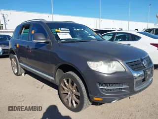 2010 Volkswagen Touareg VR6 with VIN WVGBF7A95AD002412, listed as a IAAI auction lot 41259491 with 94,104 mi miles and . Bid and sale history available at DreamBid. Image 1.