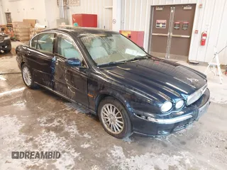 2006 Jaguar X-Type with VIN SAJWA51A56WE84382, listed as a IAAI auction lot 41594734 with 111,604 mi miles and . Bid and sale history available at DreamBid. Image 1.