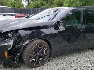 2024 BMW iX xDrive50 with VIN WB523CF09RCP70617, listed as a Copart auction lot 58091014 with 2,539 mi miles and Salvage Title. Bid and sale history available at carsss.com. Image 1.